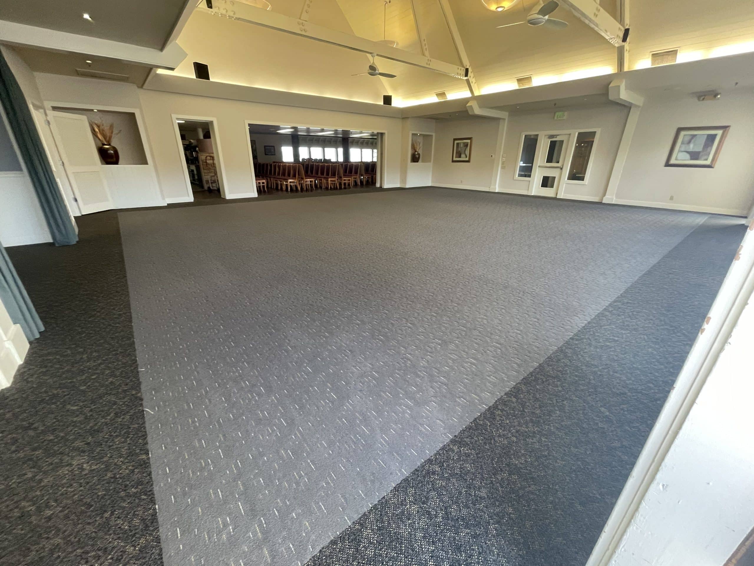 Spacious room with clean carpet flooring
