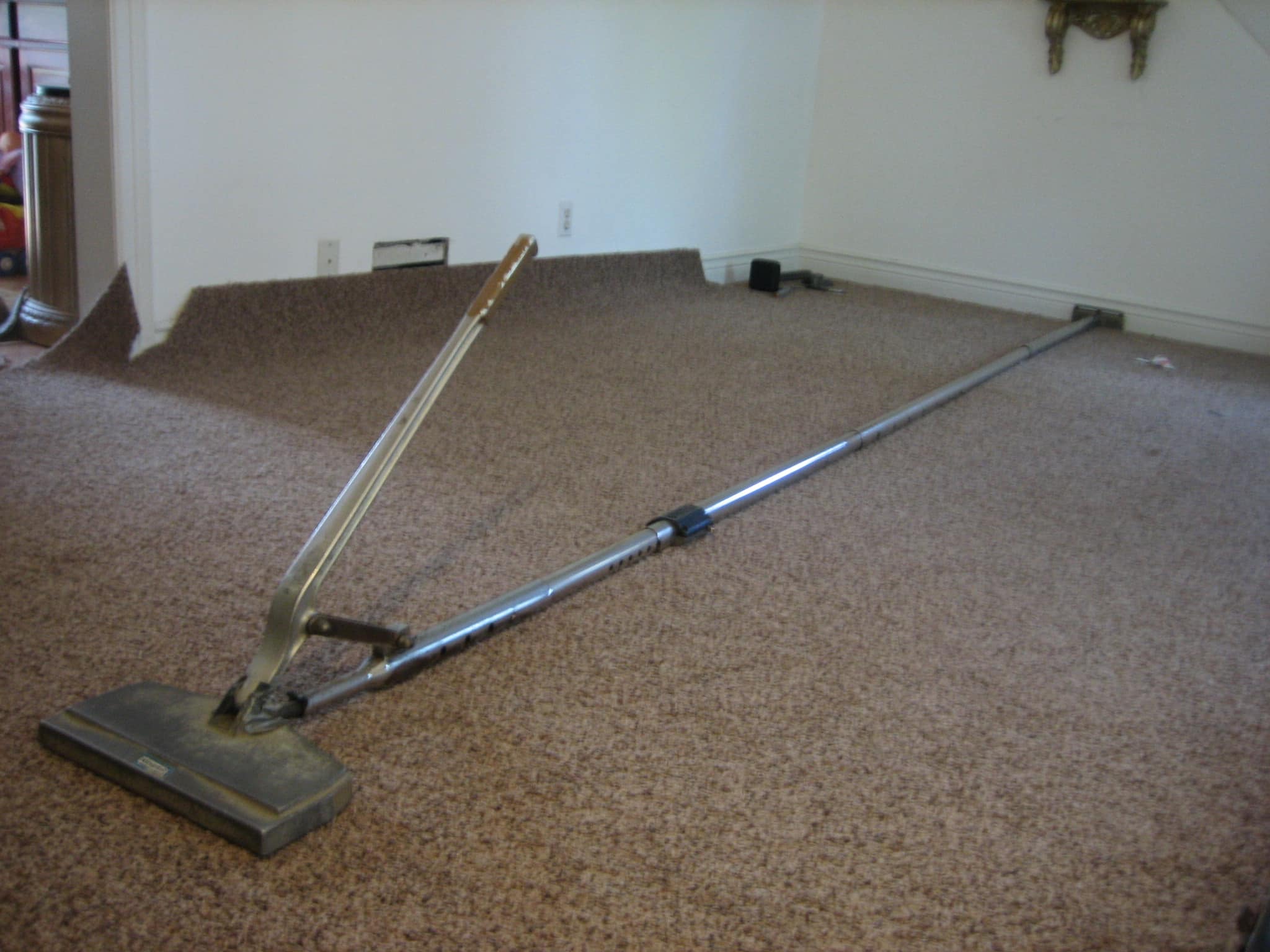 Carpet cleaning tool on floor
