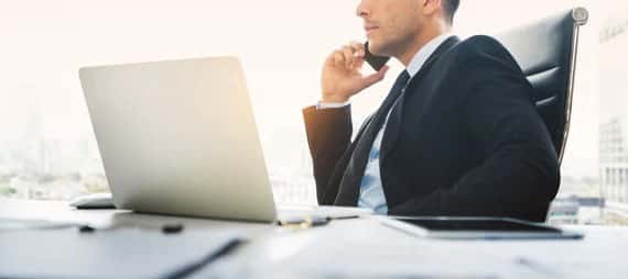 Businessman on phone at desk